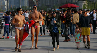 Americans Get in Trouble for Strolling Down the Bund in Speedos
