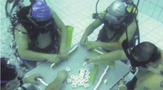 Four Men in Hunan Escape the Heat by Inventing Underwater Mahjong 