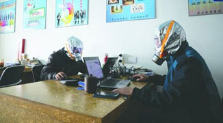 What’s that Smell? Workers in a Sichuan Office Wear Gas Masks to Work