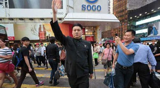 Its Uncanny! Kim Jong-un Look-alike Entertains in Hong Kong