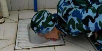 Photo of Military Student Licking a Squat Toilet Goes Viral 