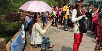 Photos of Diva Teacher Making Students Carry Her Umbrella Go Viral 