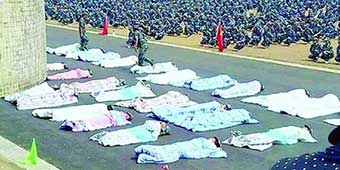 Students Forced to Lie Under Blankets in Hot Sun during Military Training