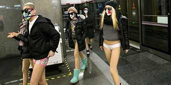 Masked Beijingers Participate in No Pants Subway Ride