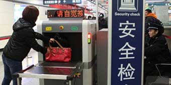 Woman Tries to Bring 2 Guns and 50 Rounds onto Beijing Subway  