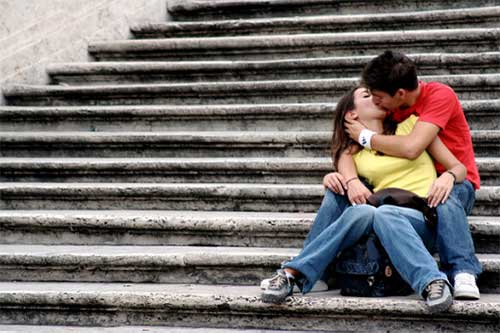 Westerners kissing on steps