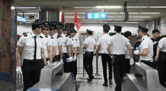 Team of Uniform-Wearing Foreigners Police the Beijing Subway