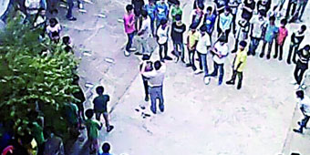 Guangxi Vice-Principal Forcibly Cuts Male Students’ Long Hair in Front of School
